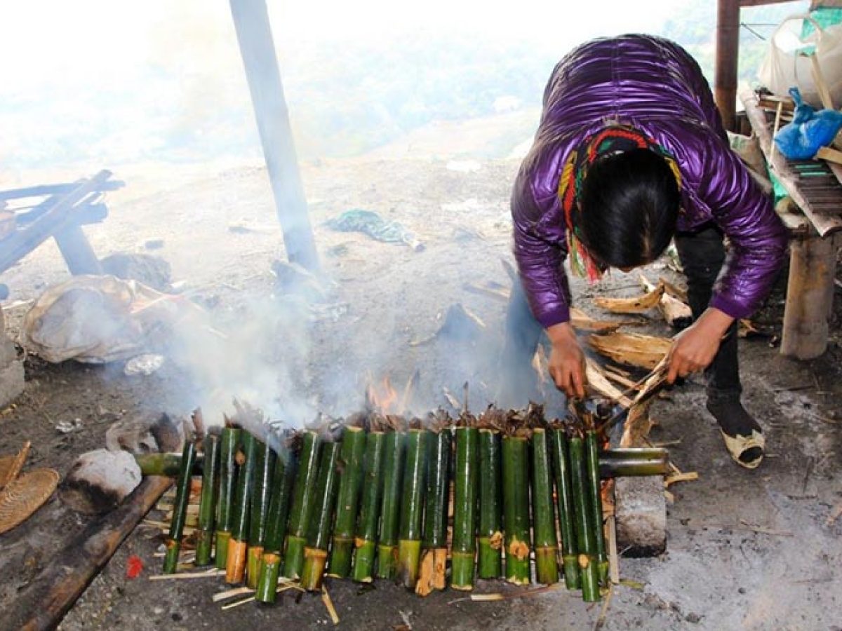Sticky rice in bamboo tube on fire, Mai Chau food