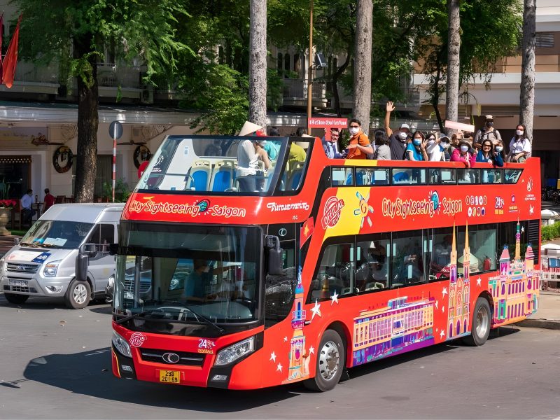 Double-decker bus takes tourists to visit the streets of Saigon